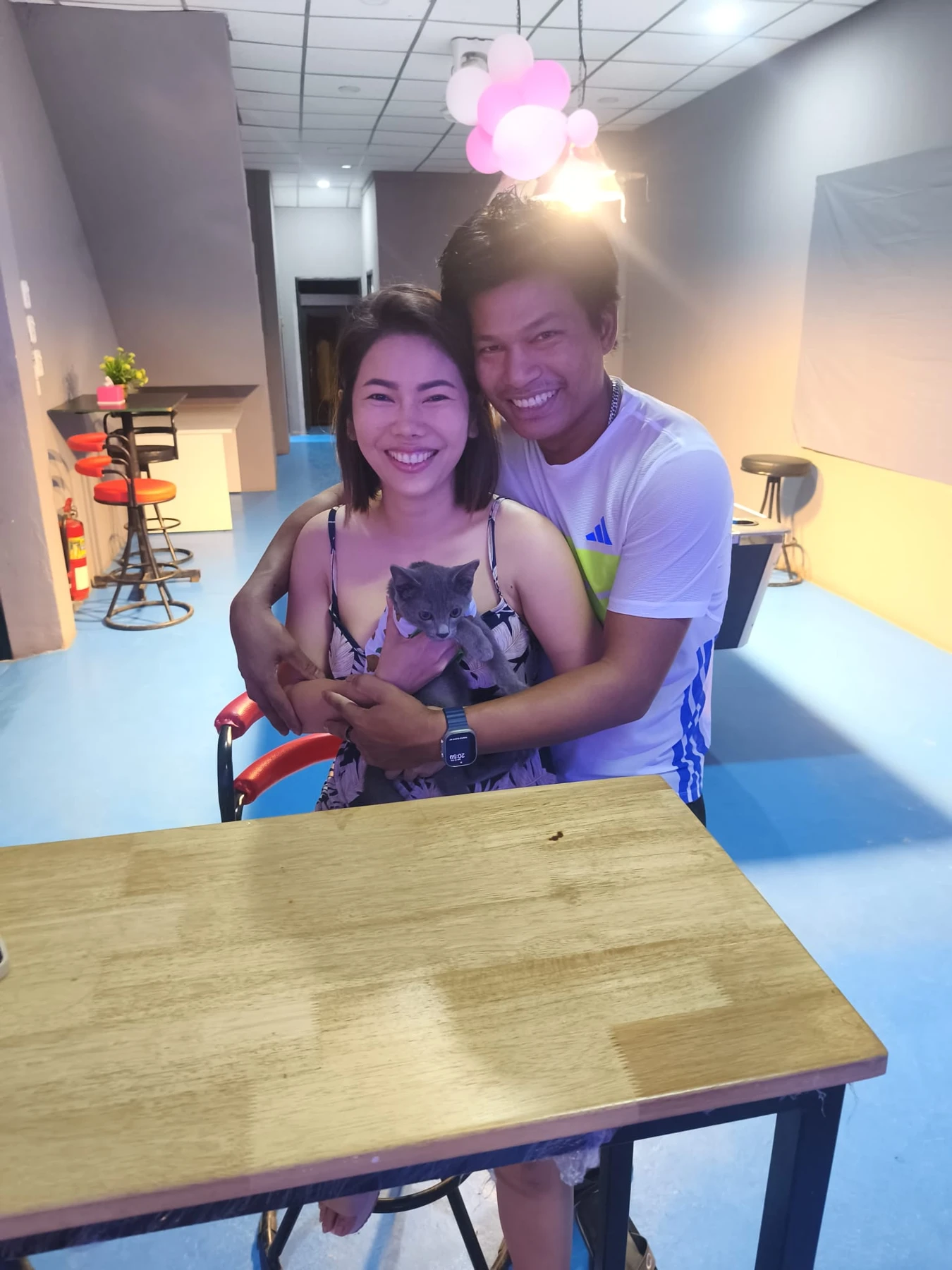 The owners of A Joy Bar welcoming guests